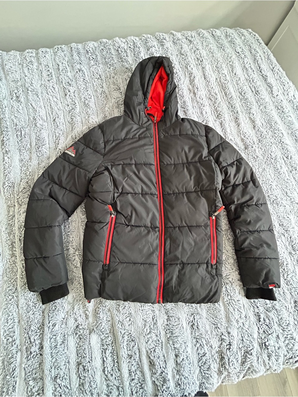 Superdry Black Hooded Puffer Jacket with Red Accents